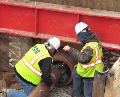 Inserting a fuel transfer pipeline into and underground housing space