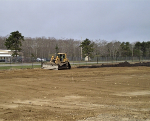 Leveling the ground after demolishing a fuel storage facility