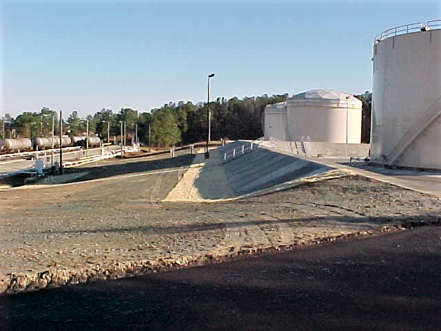 a containment area around the new fuel tank with HDPE liner with a 4” concrete cover