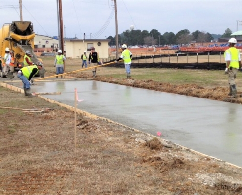 Pouring concrete for the refueler parking facility