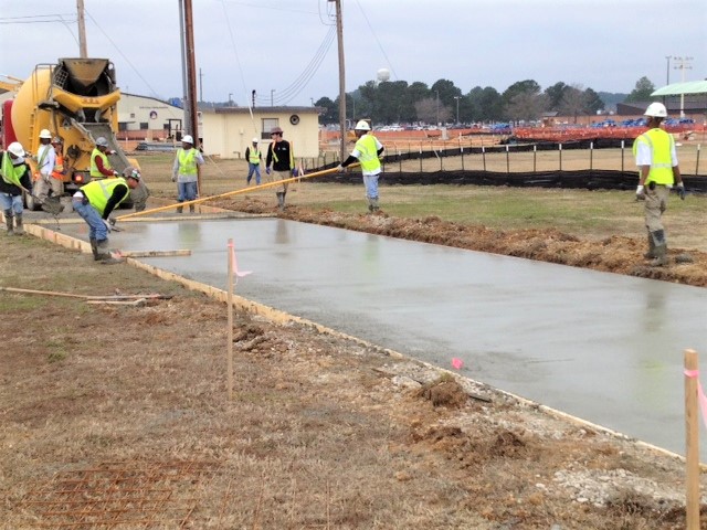 Pouring concrete for the refueler parking facility